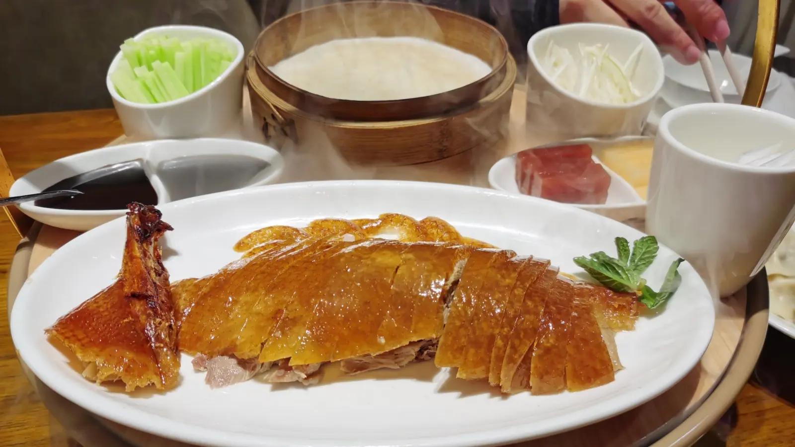 Signature crispy Peking duck sample during food tour