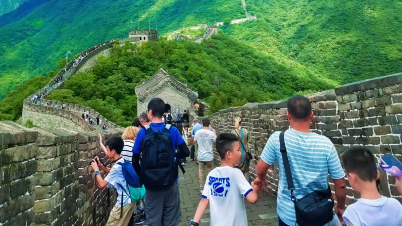 Tourists hiking near Mutianyu Great Wall watchtower